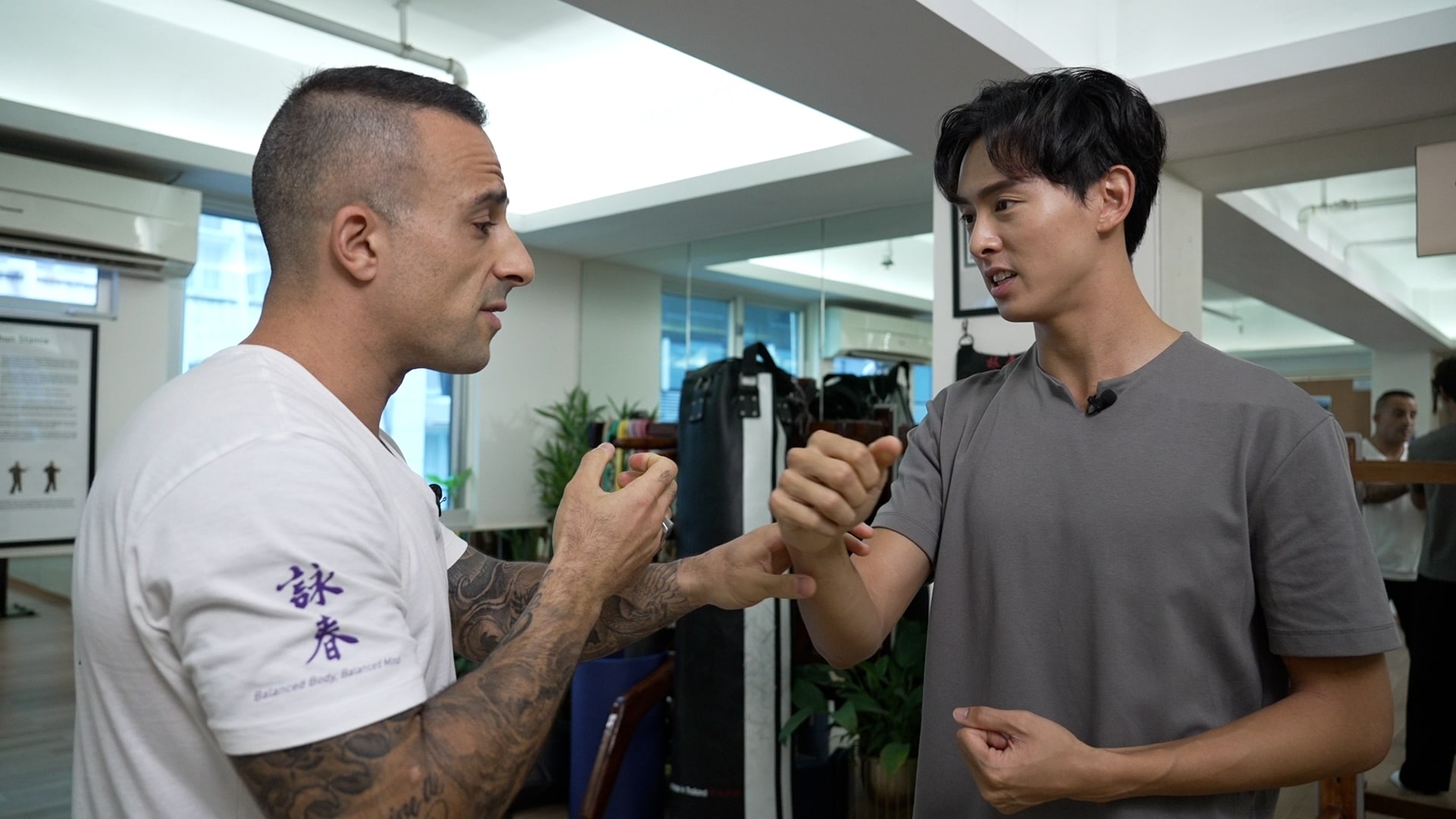 Wing Chun master Nima King demonstrated Kung-fu to presenter Vincent Tang